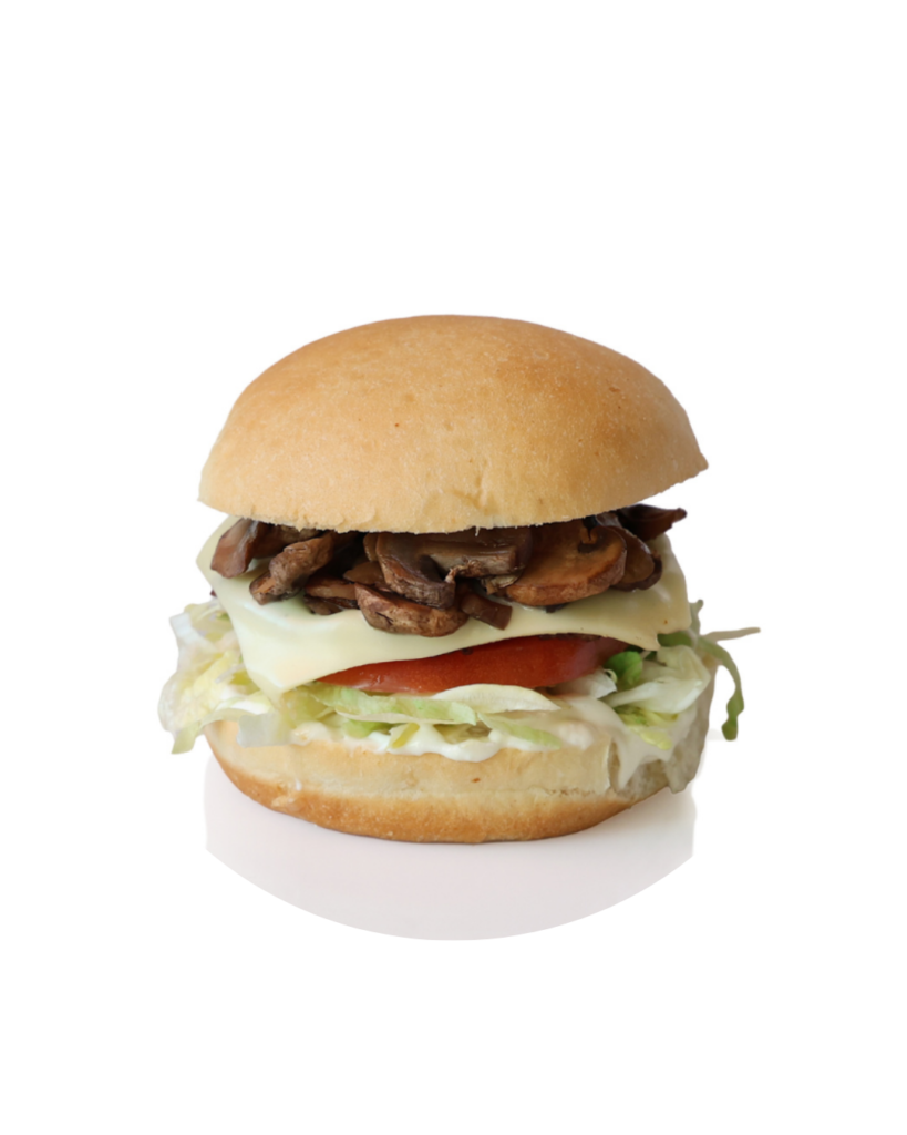 Mushroom-topped cheeseburger with lettuce and tomato on a soft bun (close-up).