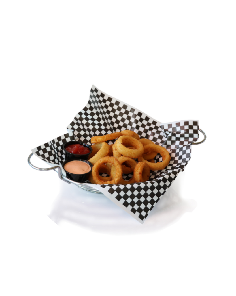 Basket of fried onion rings with two dipping sauces on black and white checker paper in a metal basket