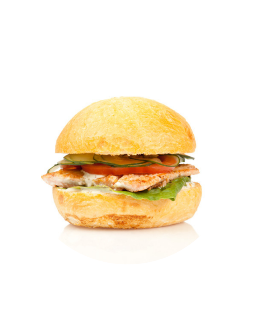 Chicken burger with lettuce tomato and pickles in a toasted bun on a white background