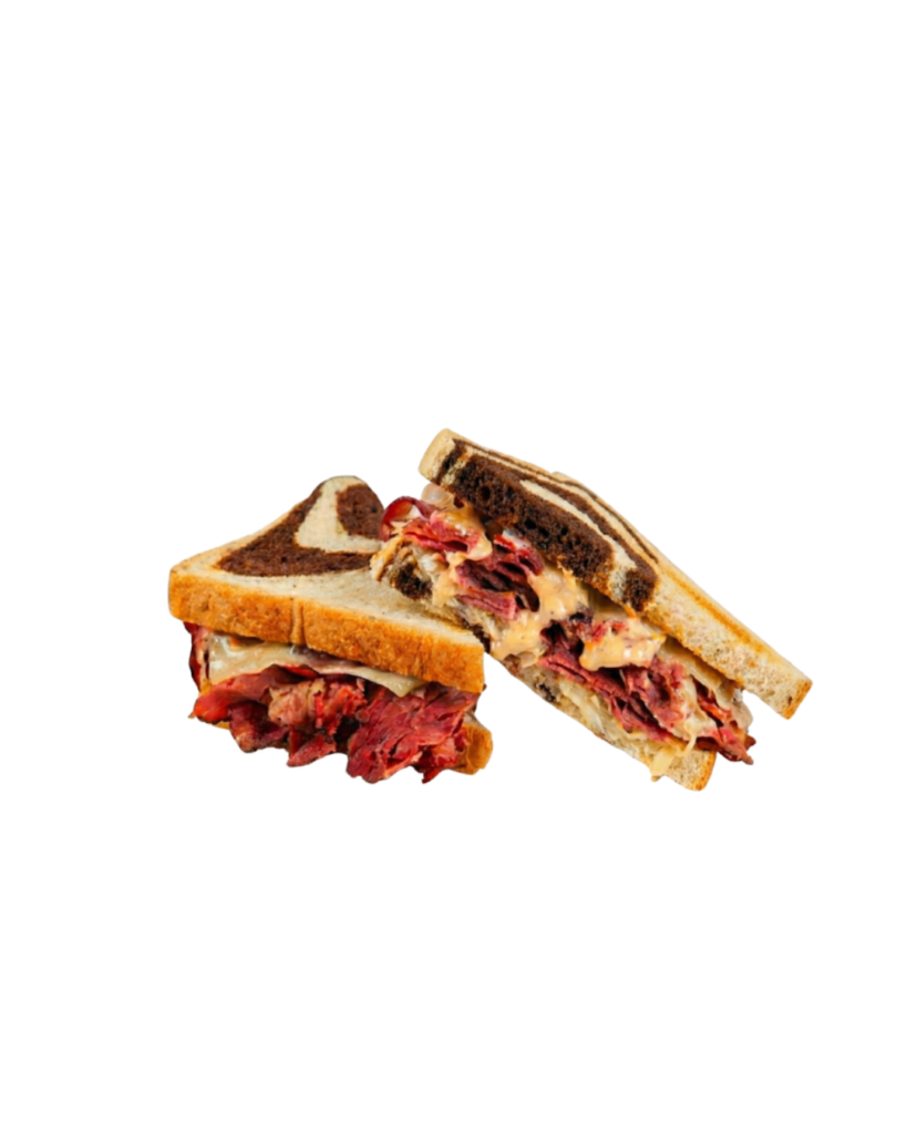 Beef sandwich halves with melted cheese on toasted bread arranged on a white circular plate on a black background