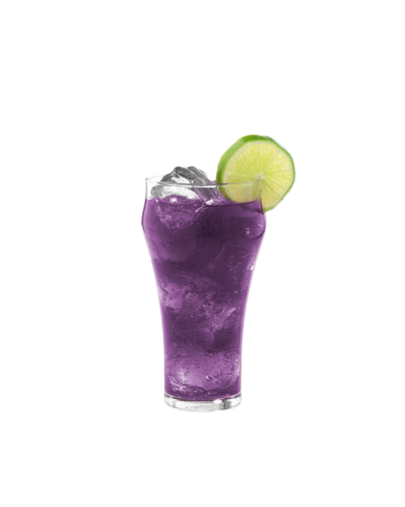 Purple cocktail in a tall curved glass with ice garnished with a lime wheel on the rim