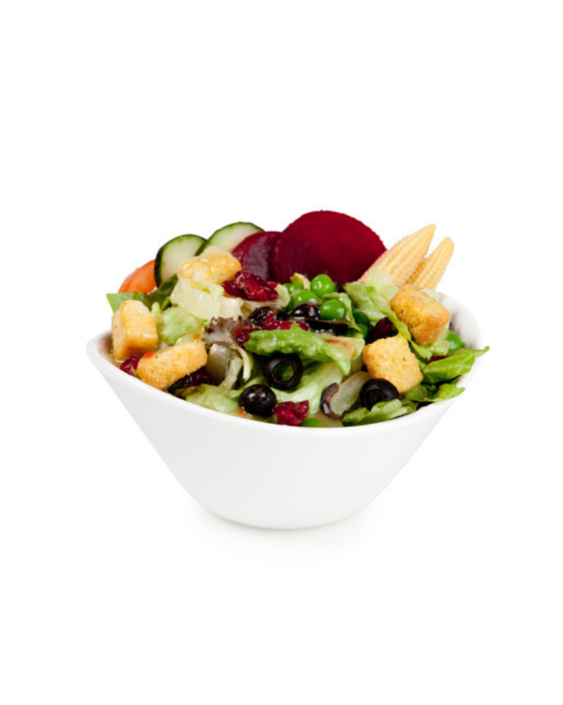 Bowl of mixed salad with croutons olives cucumber beets corn and leafy greens