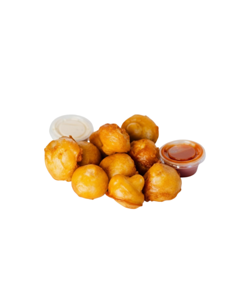Pile of golden hush puppies with white and orange dipping sauces on the side on a white background accurate to the dish's presentation