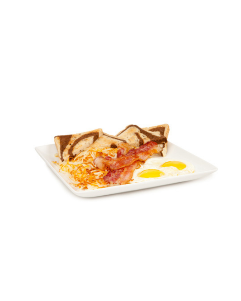 Plate of breakfast with two sunny side eggs crispy bacon toasted triangle bread and hash browns on a white dish