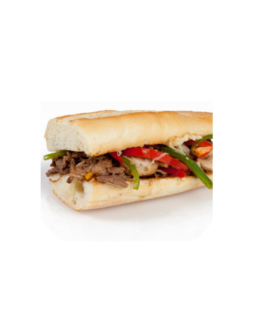 Beef sandwich with onions and green and red peppers in a crusty sub roll on a white surface