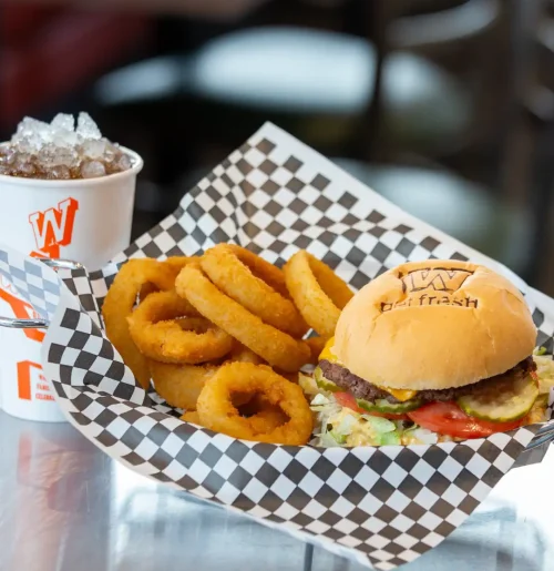 Signature Big W Burger from Warrens Restaurant stacked with fresh toppings and served hot in Northern Utah.